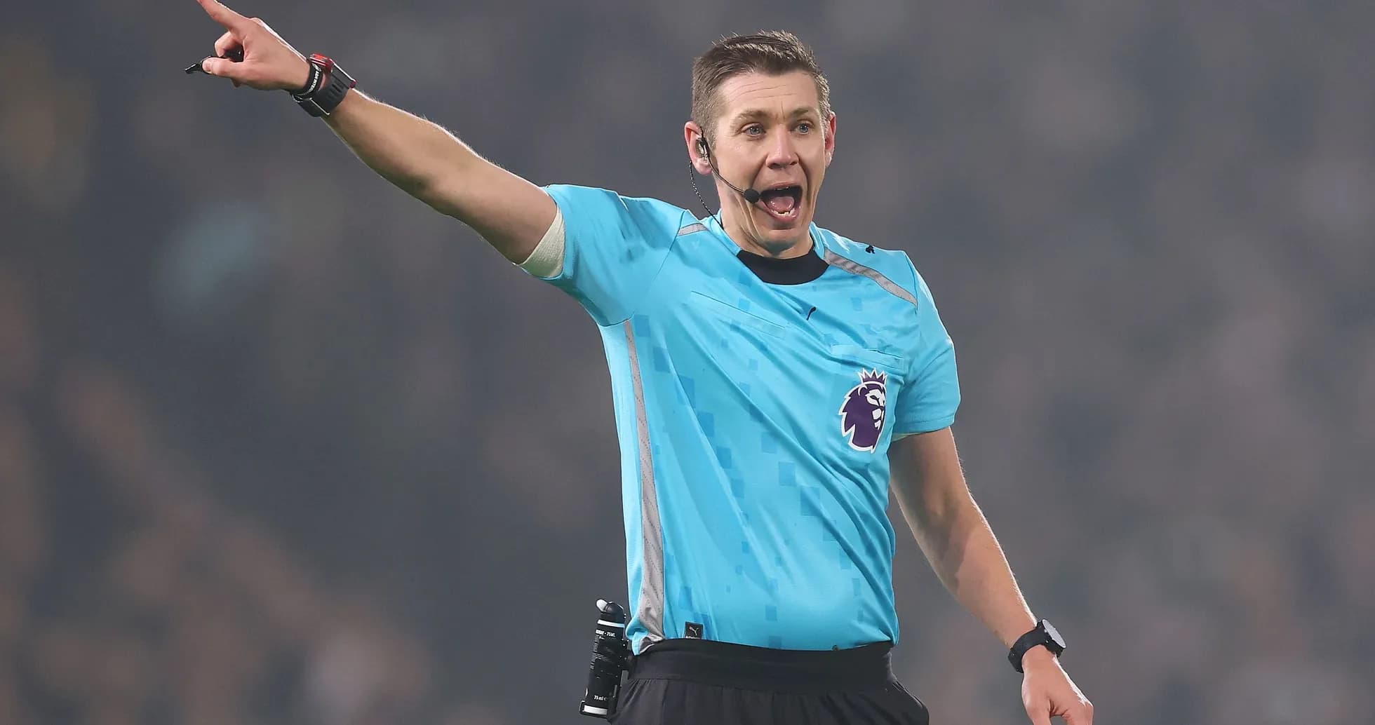Referee signaling during a football match