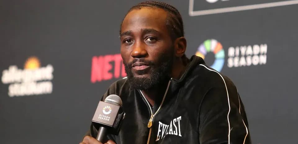 Boxer speaking at press conference with microphone