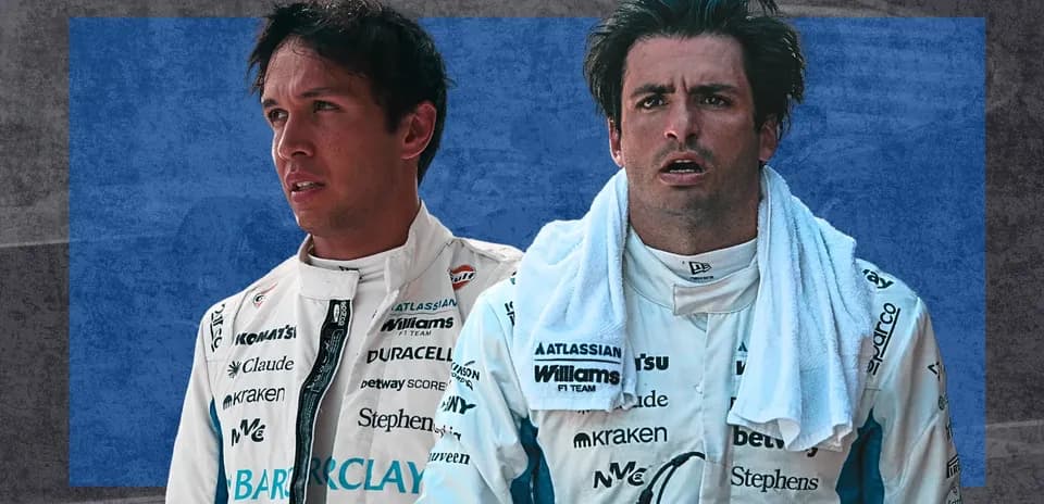 Two Formula 1 drivers in team uniforms
