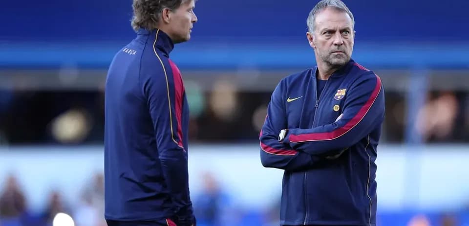 Two coaches discussing strategy before the match