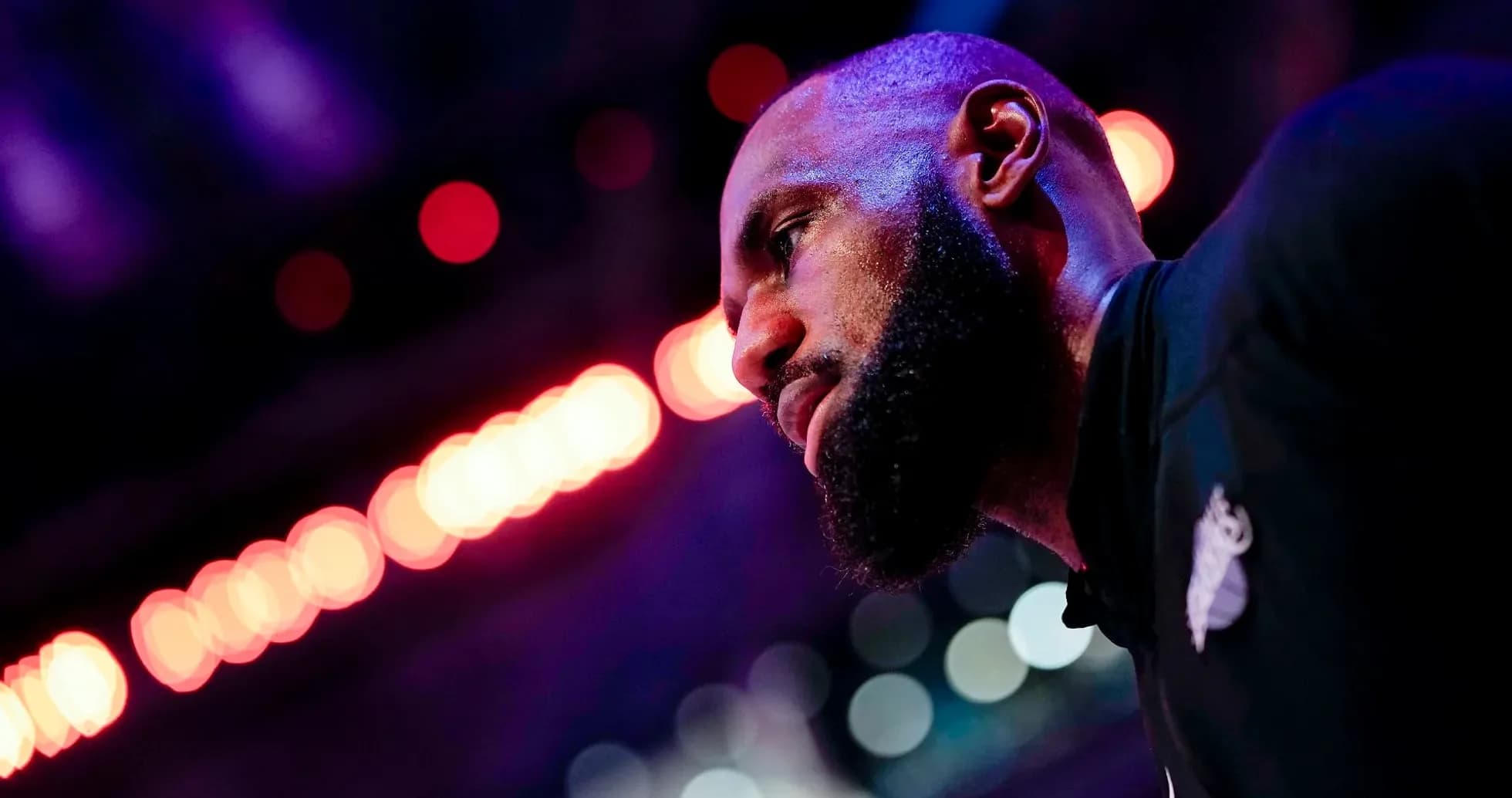 Basketball player in profile with colorful lights