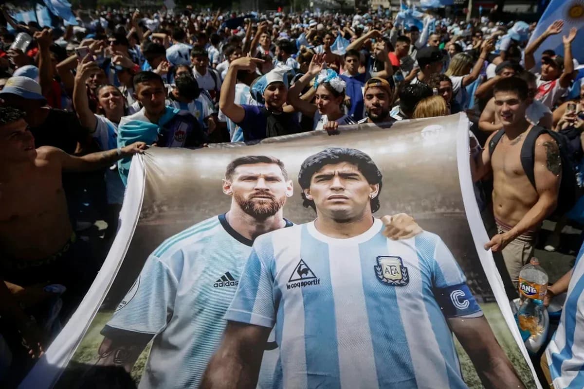 Fans holding banner of Messi and Maradona together