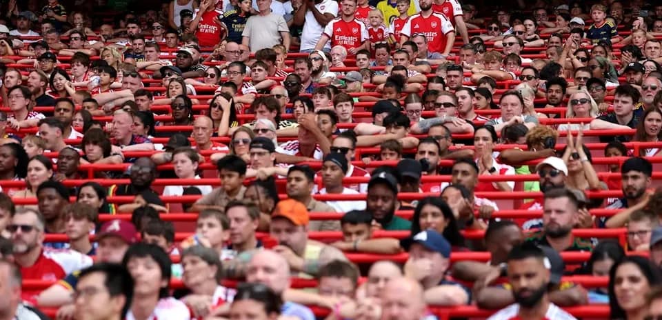 Arsenal fans in stadium during a match