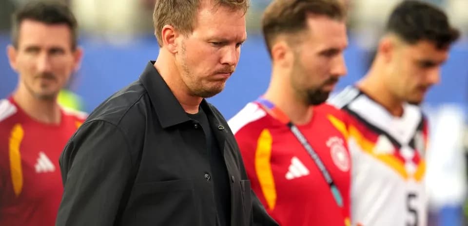 Trio of players walking off the pitch together