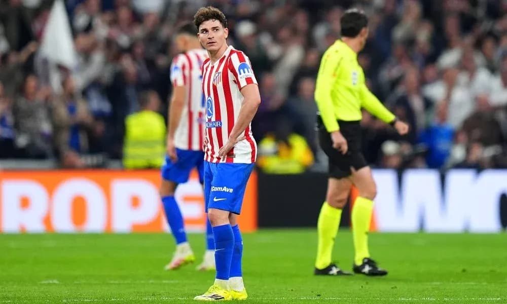 Atletico Madrid player looking disappointed on pitch