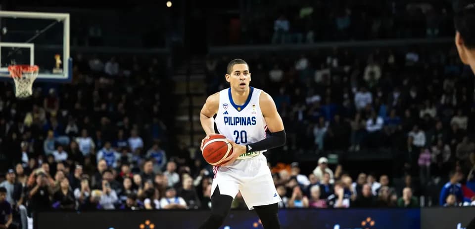 Basketball player from Pilipinas preparing to pass ball