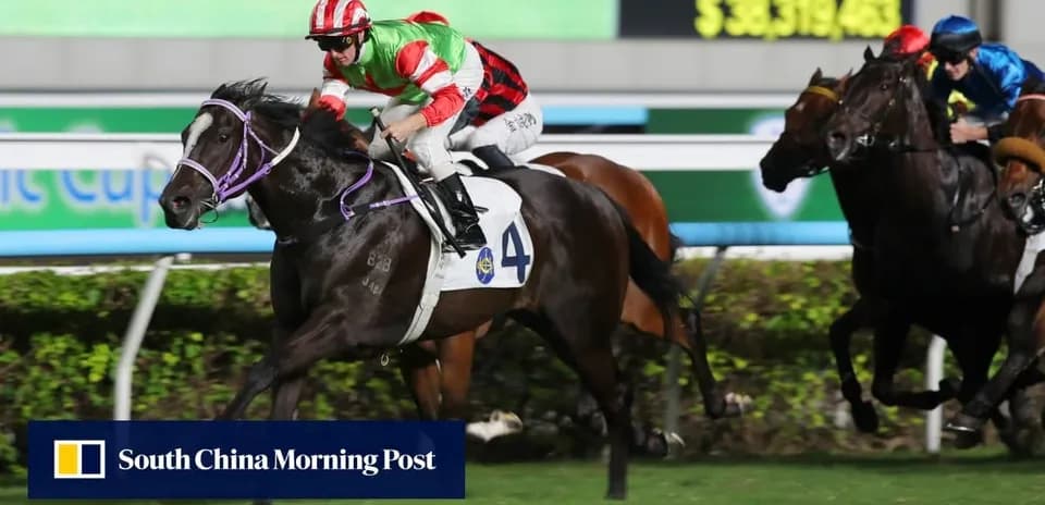 Jockey riding horse during a race at night