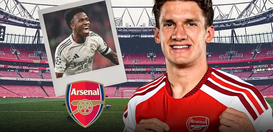 Arsenal player smiling in home kit at stadium