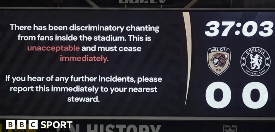 Stadium screen warning about discriminatory chanting