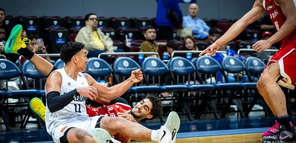 Two players on the floor after a play