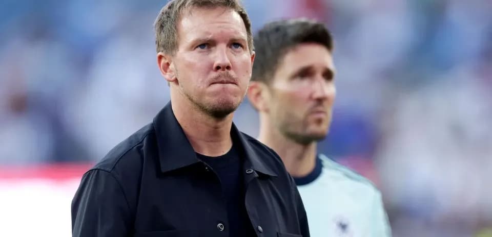 Two coaches on the sidelines before the match