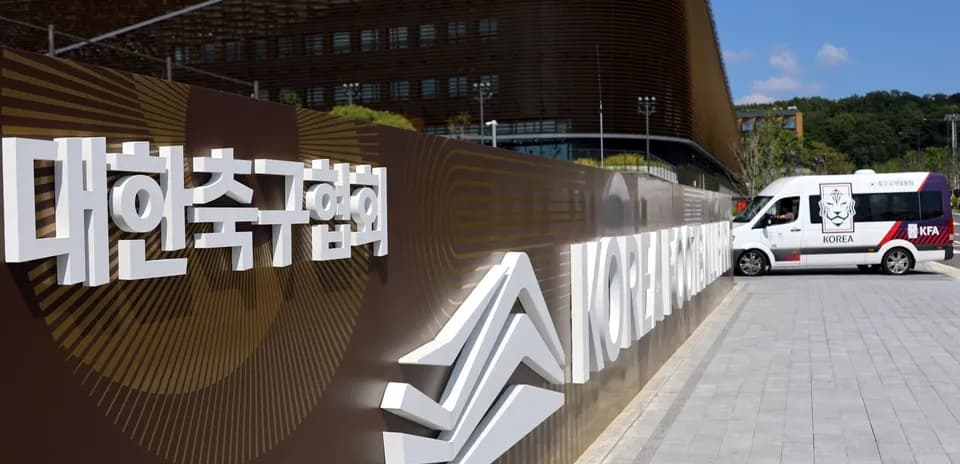 Korea Football Association sign with vehicle nearby