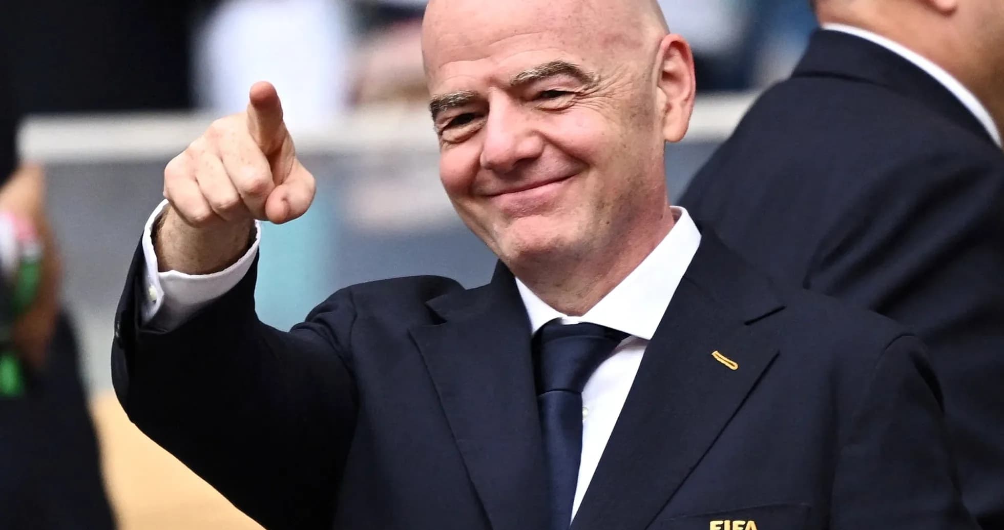 FIFA president pointing and smiling at event