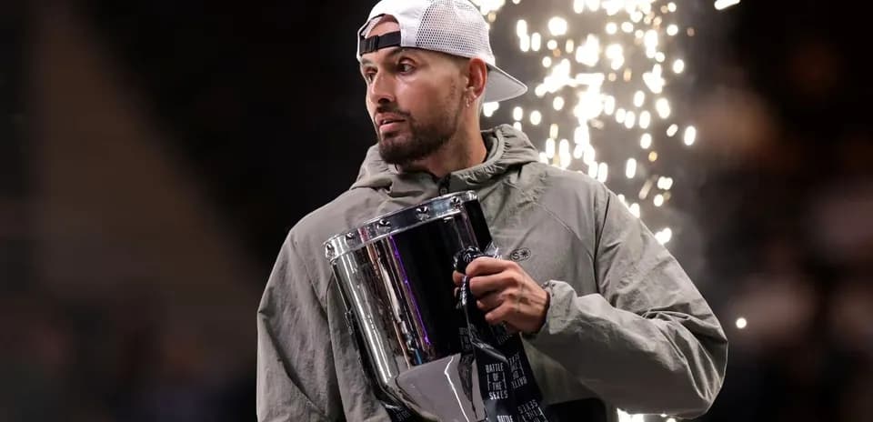 Athlete holding trophy with fireworks in background