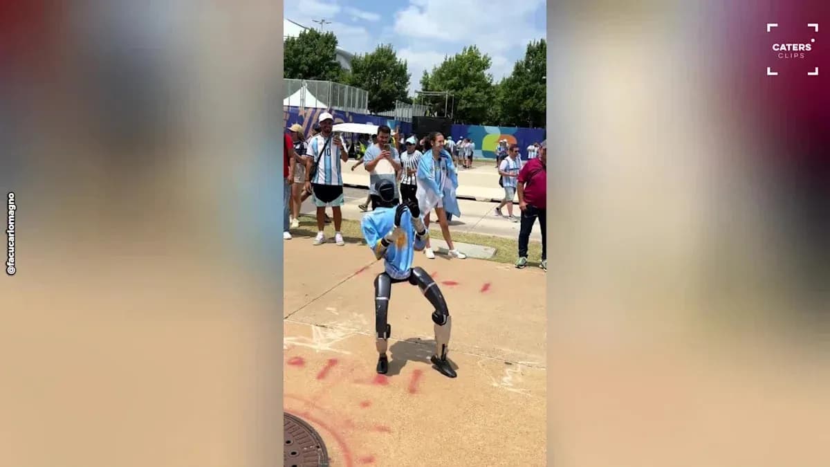 Robot performing dance in front of spectators