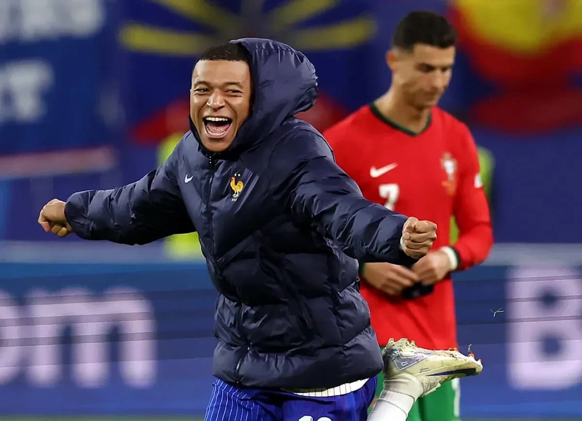 Kylian Mbappé celebrating with teammates during match
