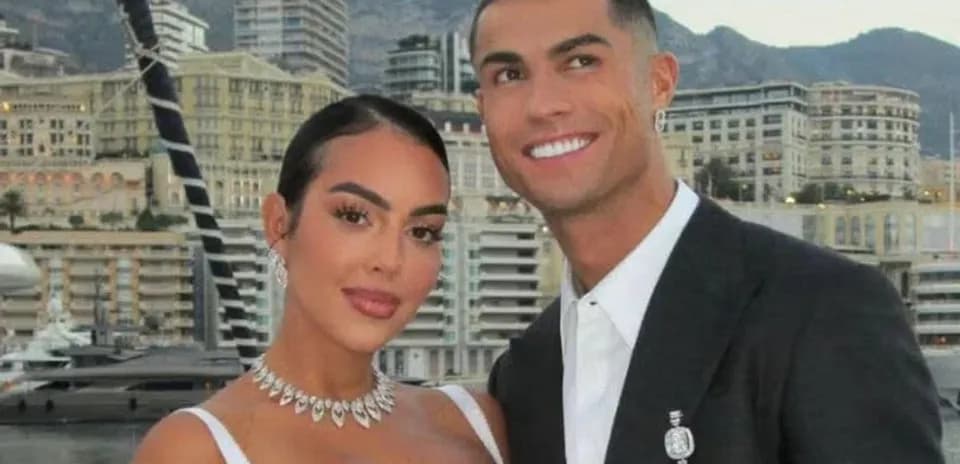 Couple posing together with cityscape background