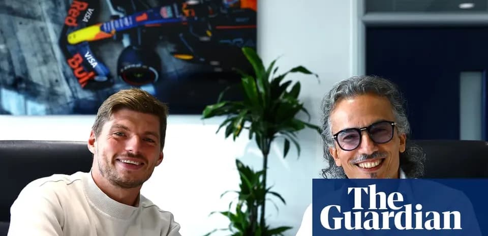 Two men smiling in an office setting