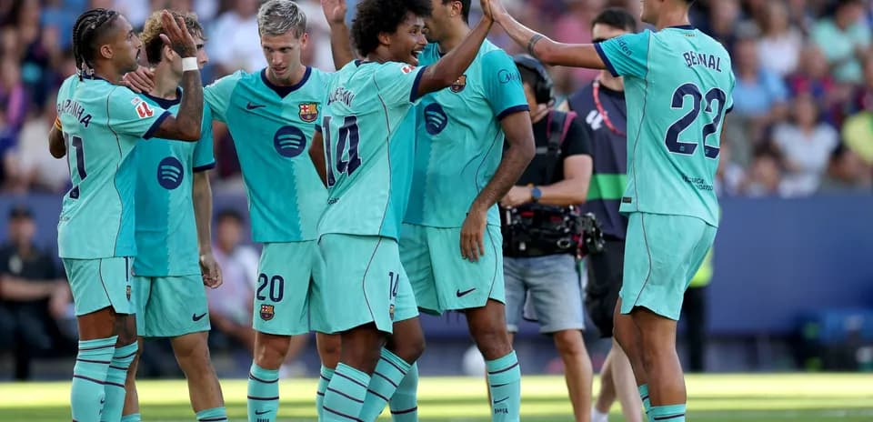 Barcelona players celebrating a goal during match