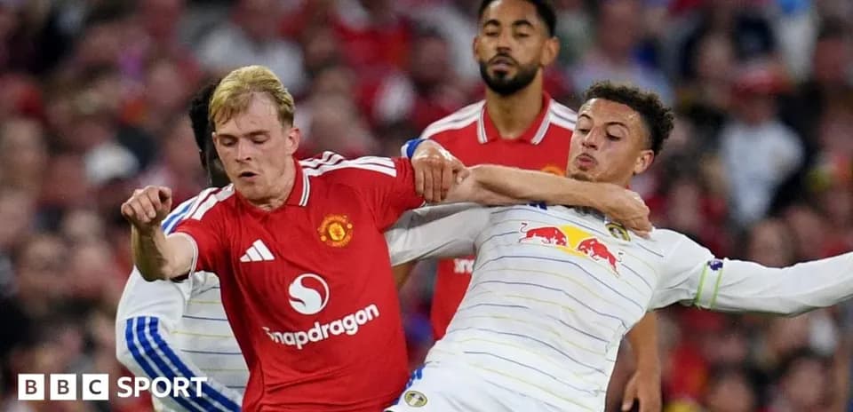 Two players competing for the ball during match