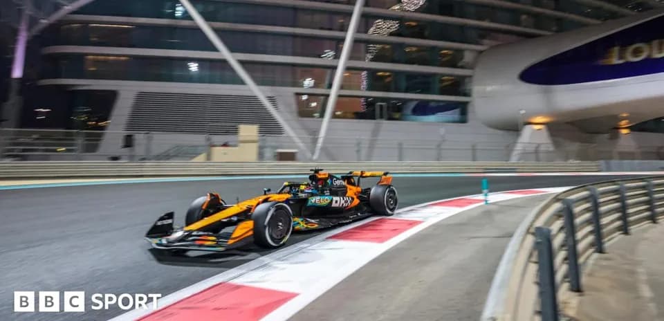 Formula 1 car racing on track at night