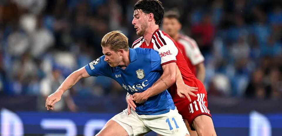 Two players battling for possession during match