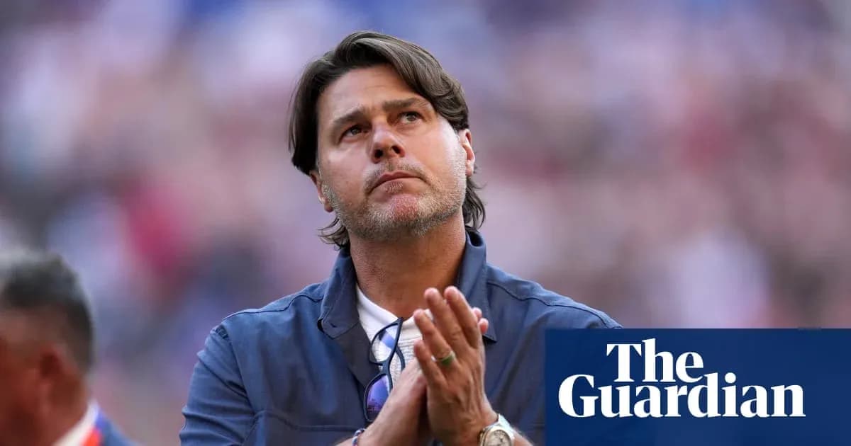 Men's football coach looking up during match