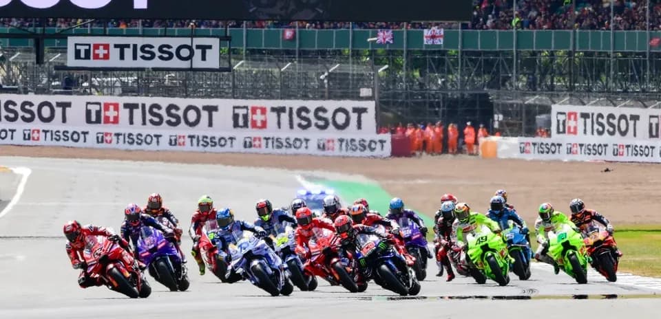 Motorsport race with multiple riders on track