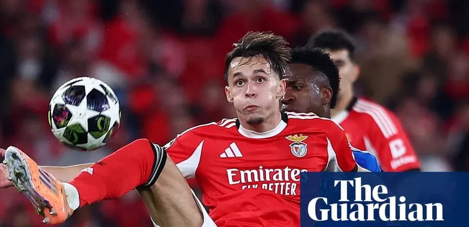Benfica player attempting to control the ball mid-air
