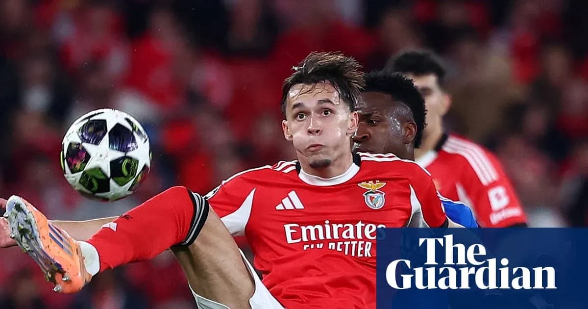 Benfica player attempting to control the ball mid-air