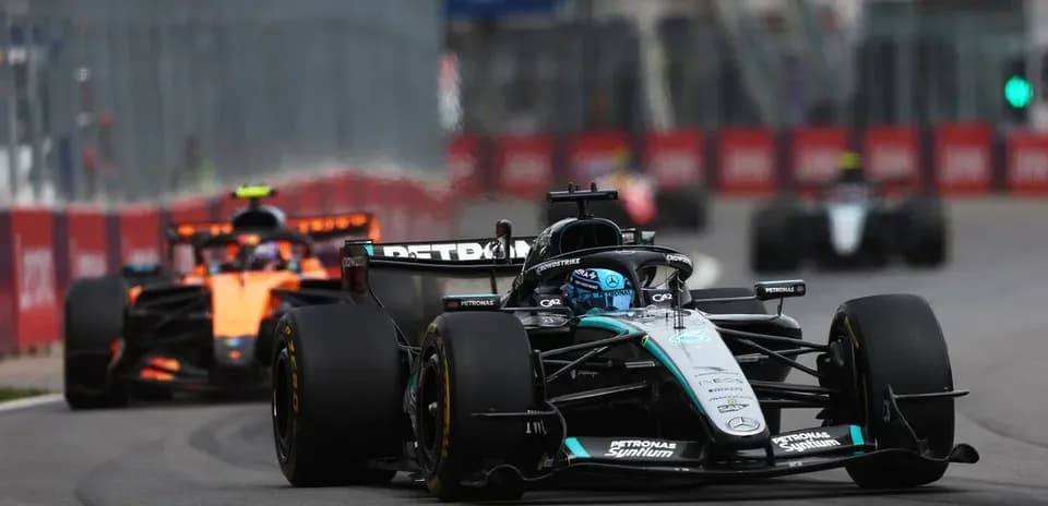 Mercedes and McLaren cars racing on track