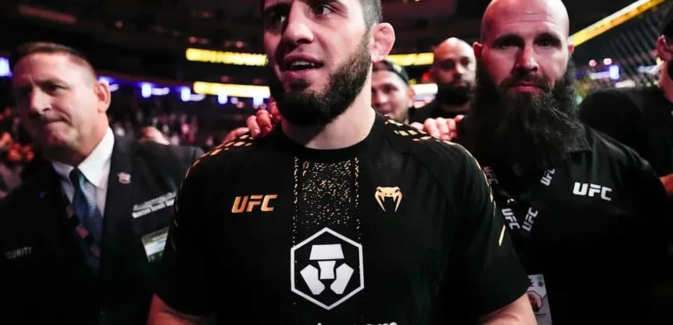 MMA fighter entering the arena with support team