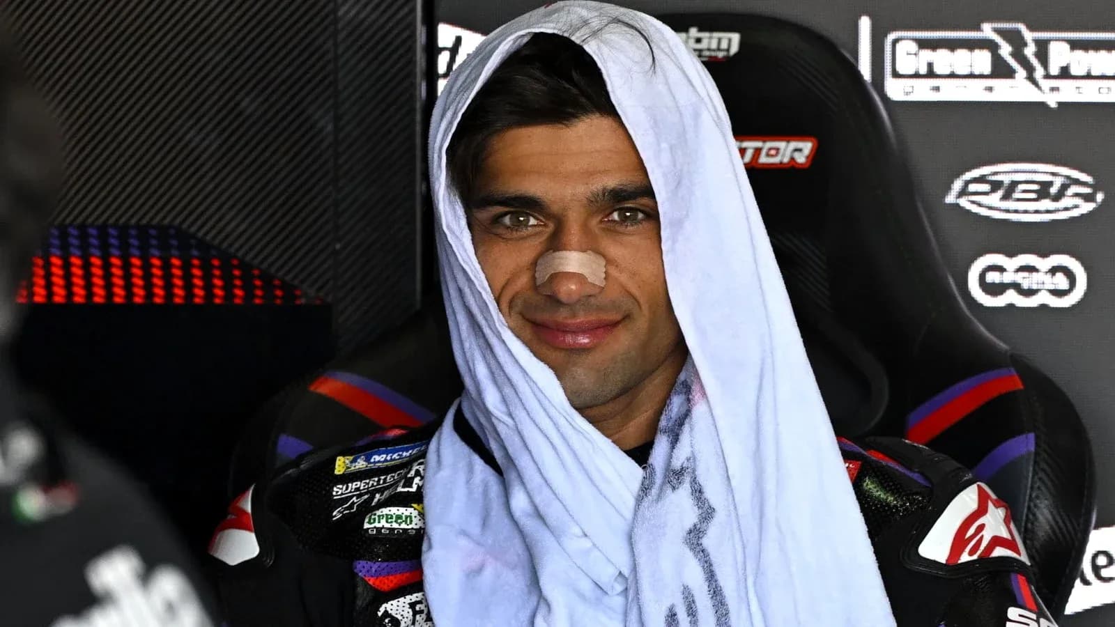 Motorsport athlete wearing a towel and bandage