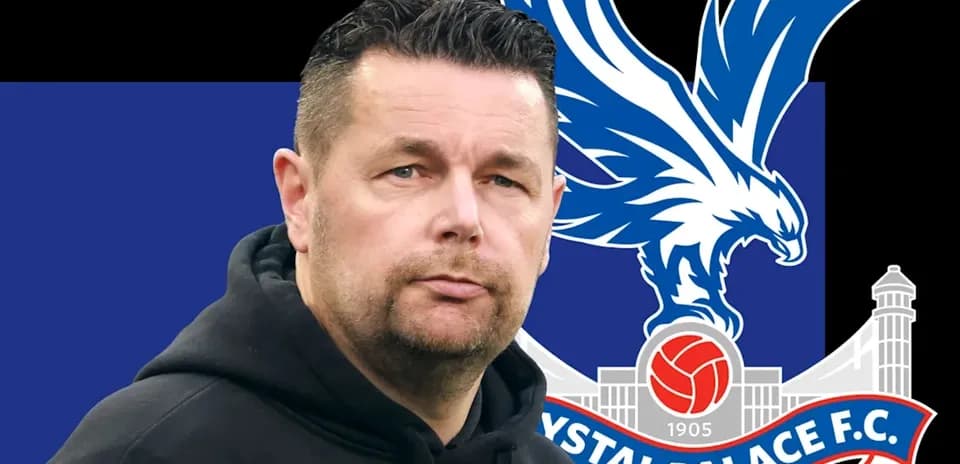 Crystal Palace F.C. logo with coach in foreground