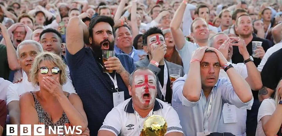 Fans reacting during a tense football match