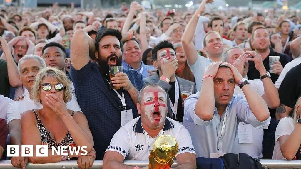 Fans reacting during a tense football match