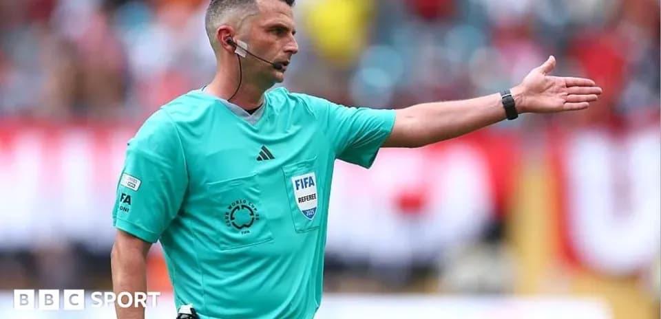 Referee signaling during a football match