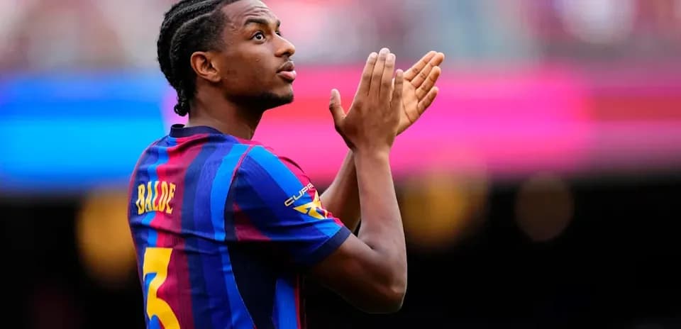 Barcelona player applauding fans during match