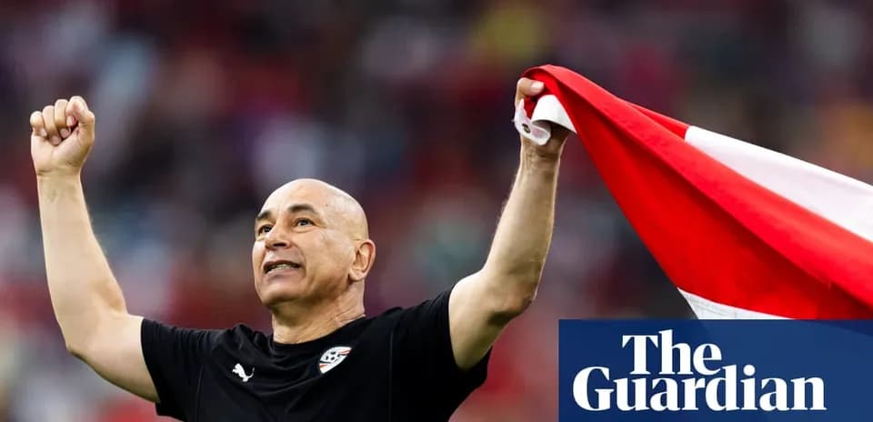Coach celebrating with national flag after match