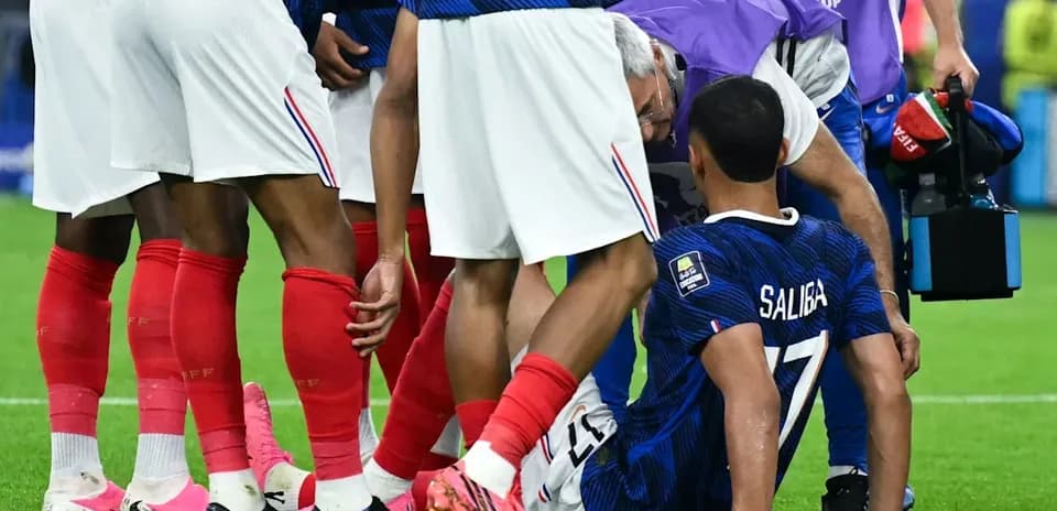 Saliba receiving medical attention on the field