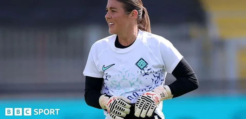 Goalkeeper preparing during training session on pitch