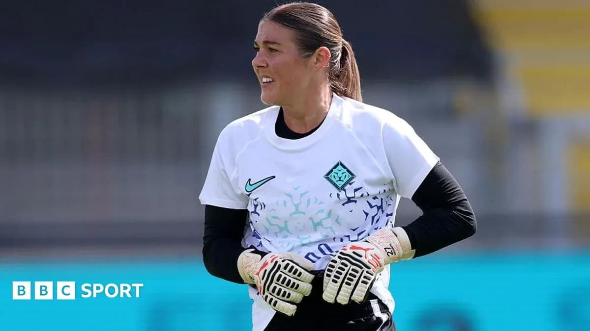 Goalkeeper preparing during training session on pitch