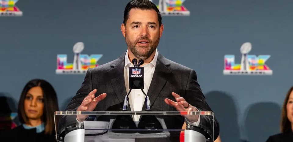 Spokesperson speaking at NFL press conference podium