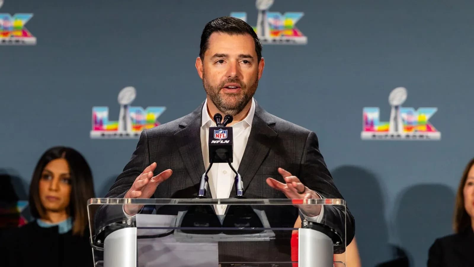 Spokesperson speaking at NFL press conference podium