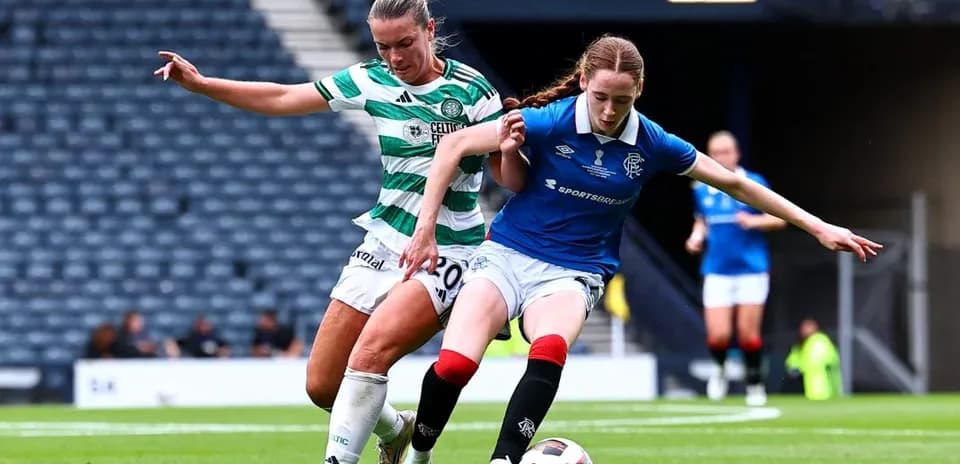 Celtic and Rangers players competing for the ball