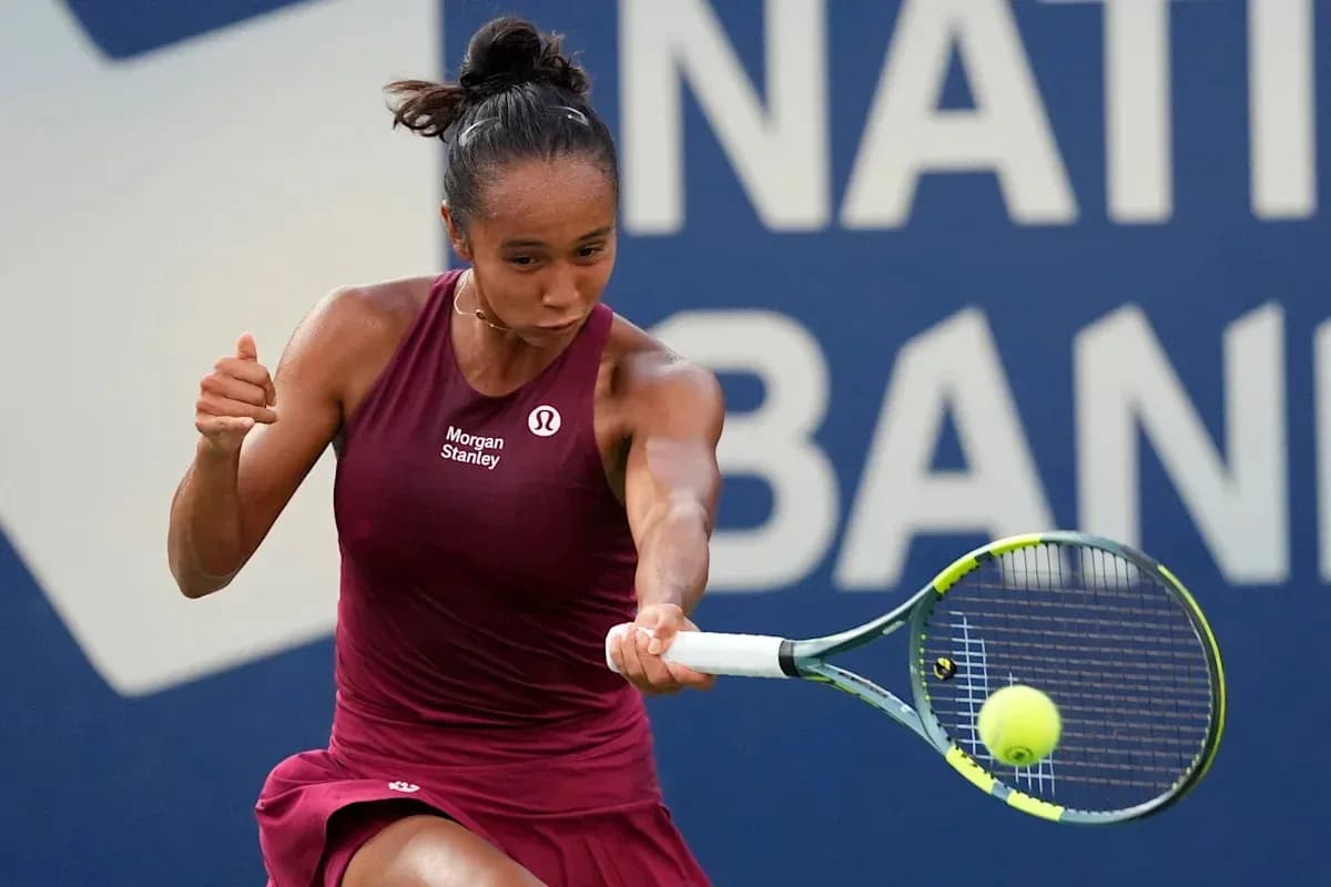 Tennis player hitting a forehand shot during match