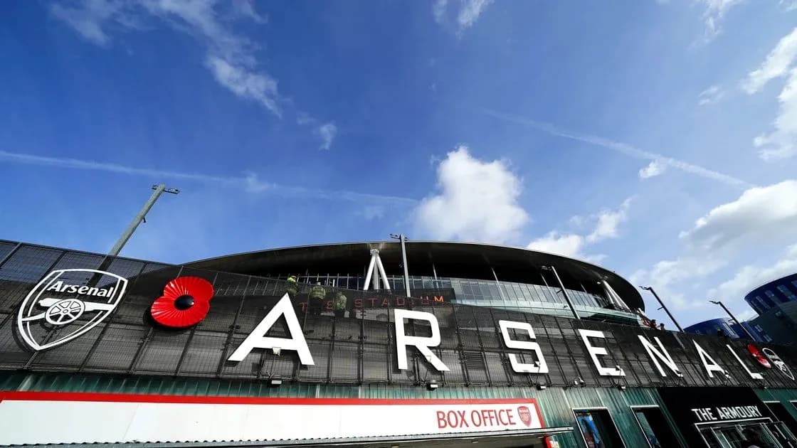 Arsenal Stadium exterior with logo and poppy