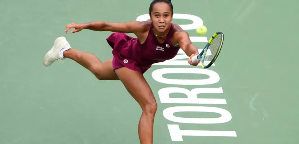 Tennis player executing a backhand shot in Toronto
