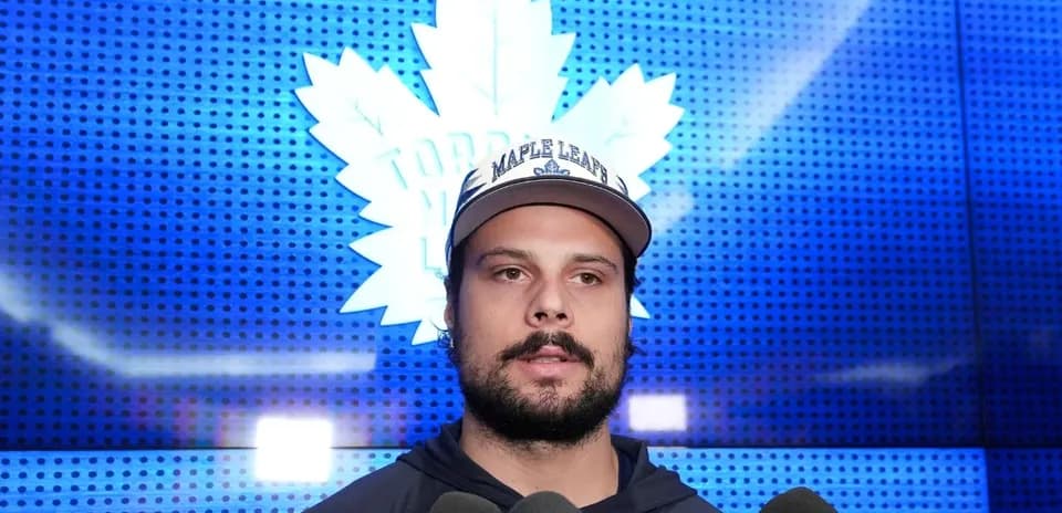 Player speaking at press conference with media
