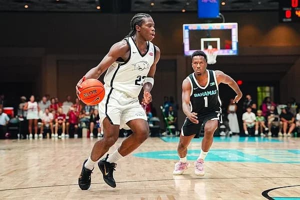 Player dribbling basketball during game action